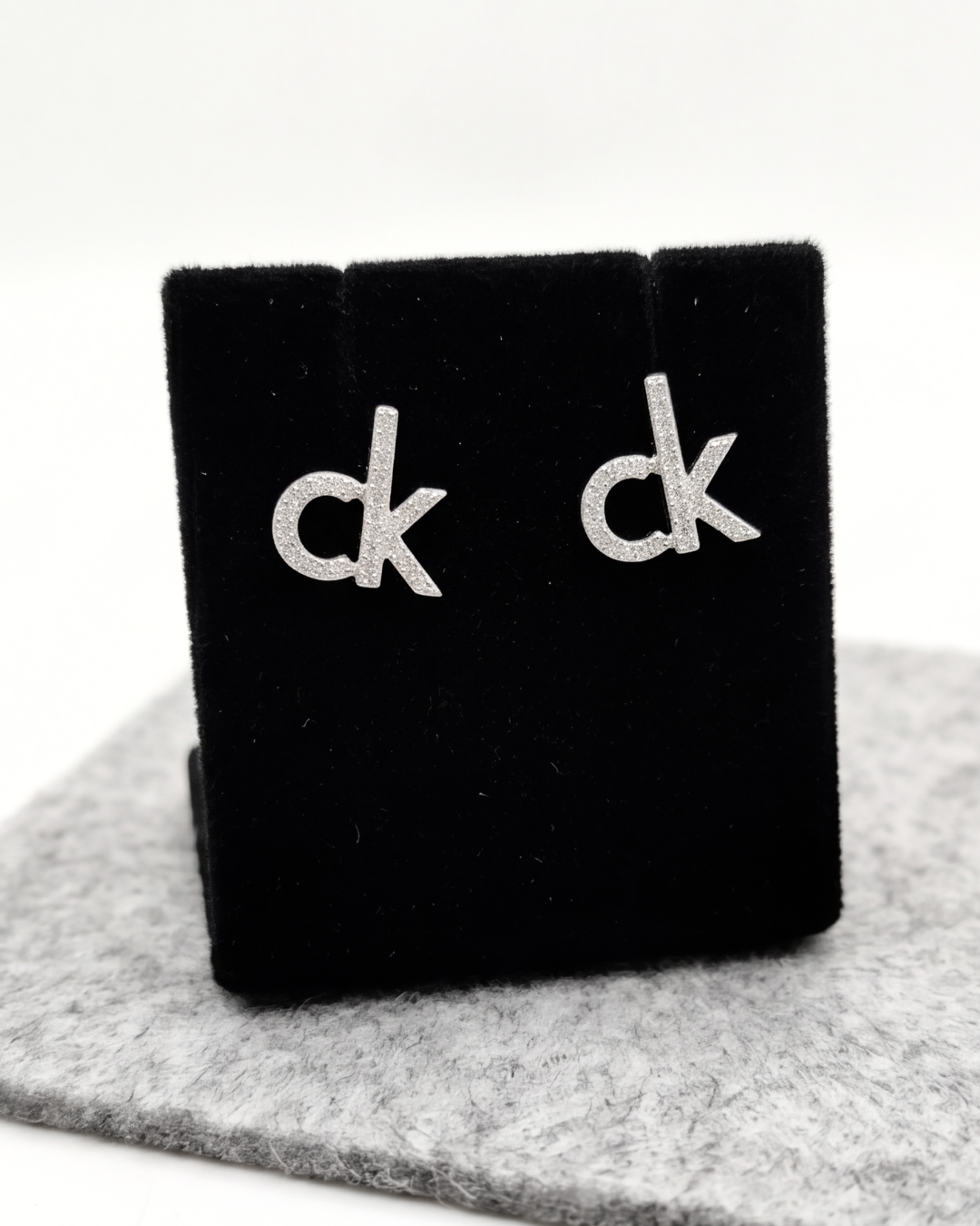 CK Signature Stud Earrings