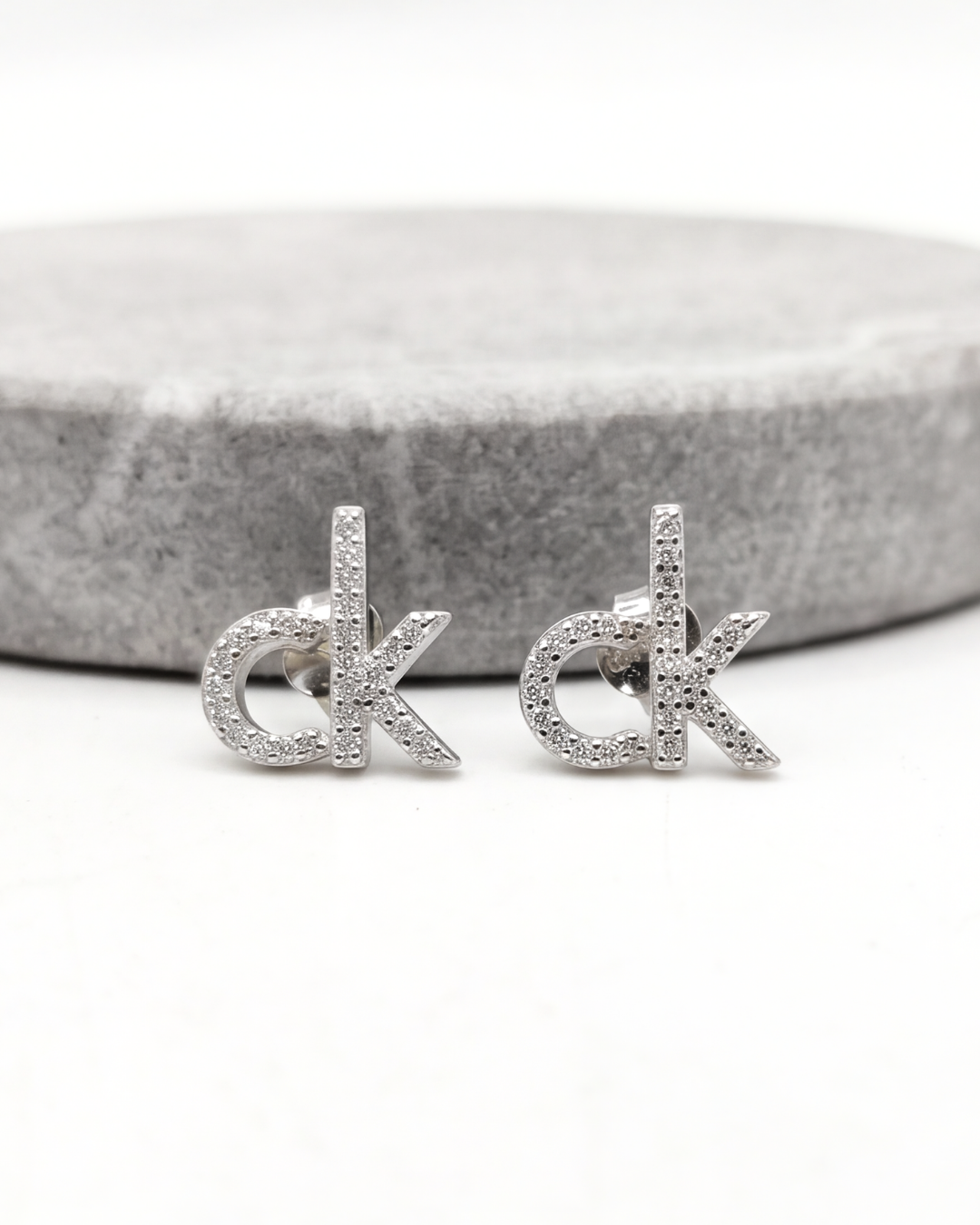 CK Signature Stud Earrings