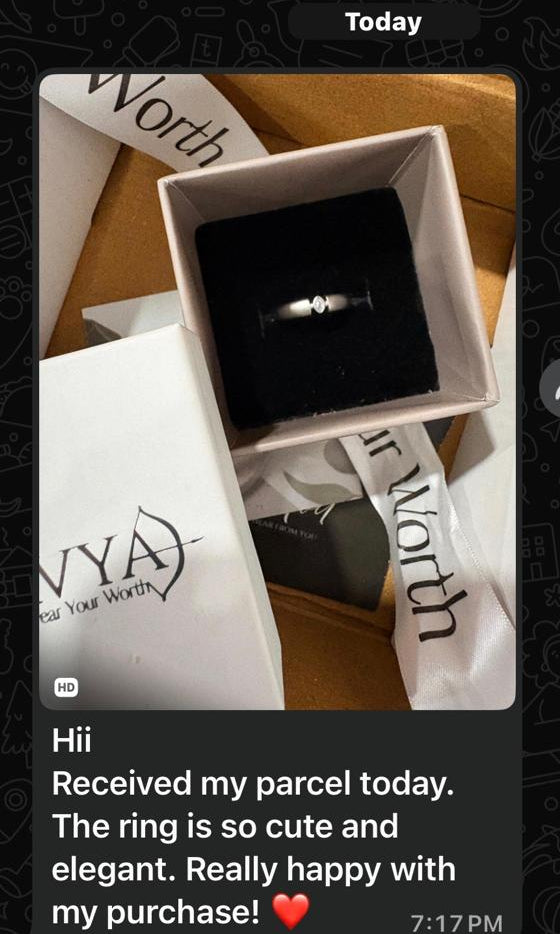 Product image with a ring in a box, text feedback, and brand name on a smartphone screen.